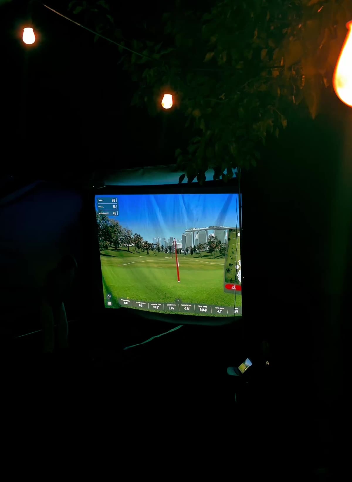 A TILT golf simulator set up at a wedding reception